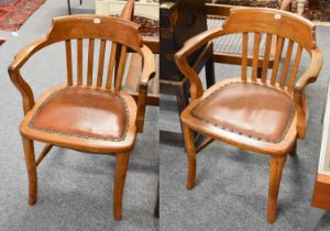 A Pair of Early 20th Century Oak Office Chairs, with studded leather seats (2)