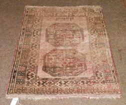 Afghan Turkmen Rug, the field with two elephant foot medallions enclosed by flowerhead borders,