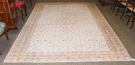 Anatolian Carpet, the ivory field with an allover design of vines and flowers enclosed by meandering