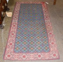 Needlepoint Rug, the diamond lattice field of cruciform guls enclosed by kufic borders, 212cm by