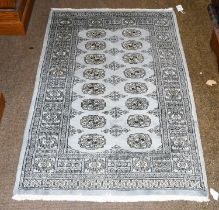 "Bukhara" Rug, the steel blue field with two columns of quartered guls, enclosed by