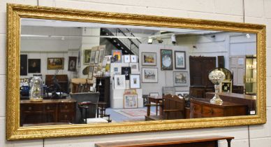 A Large Gilt Framed Mirror, 177cm by 74cm