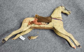 A Child's 19th Century Carved and Painted Wooden Rocking Horse, 80cm long by 58cm high (a/f)