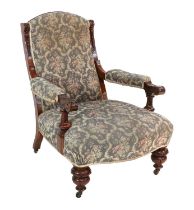 A Victorian Carved Walnut and Upholstered Armchair, 3rd quarter 19th century, recovered in floral