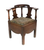 A George III Joined Oak Corner Chair, late 18th century, the moulded back support above turned