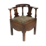 A George III Joined Oak Corner Chair, late 18th century, the moulded back support above turned