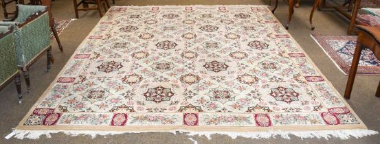 European Hand-Knotted Carpet of 19th Century Design, the cream field with columns of floral