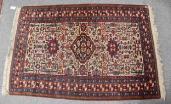 Ardabil Rug, the ivory field of tribal and zoomorphic devices enclosed by harshang borders, 164cm by