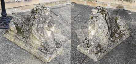 A Pair of Reconstituted Stone Recumbent Lions