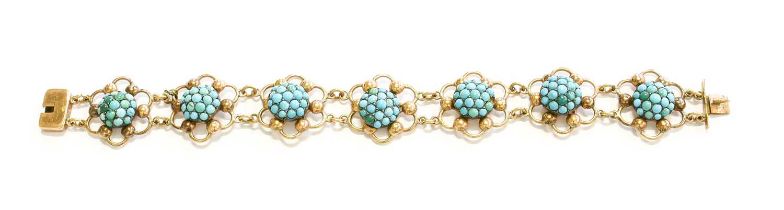 A Turquoise Bracelet, seven chain linked foliate turquoise clusters within yellow plain polished