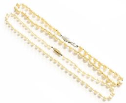 A Single Row Cultured Pearl Necklace, knotted to a clasp stamped '14K' and '585', length 43cm; and