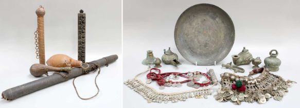 Middle Eastern Metalwares, copper scroll canister, bronze oil lamps, together with a carved powder