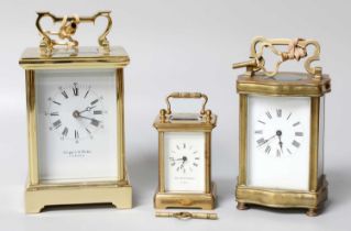 A Brass Carriage Timepiece, circa 1900, together with two modern brass carriage timepieces, retailed