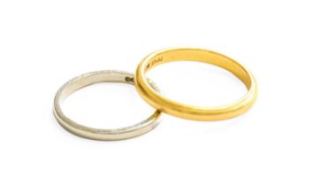 A 22 Carat Gold Band Ring, finger size O1/2; and A Band Ring, stamped 'PT', finger size L 22 carat