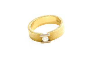 An 18 Carat Gold Diamond Solitaire Ring, the matte yellow band with a raised round brilliant cut