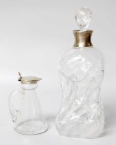 A Silver Mounted Whisky Tot, together with a silver mounted decanter (2)