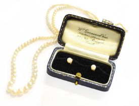 A Single Row Cultured Pearl Necklace, the graduated cultured pearls knotted to a trio of old cut