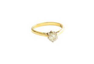 An 18 Carat Gold Diamond Solitaire Ring, the round brilliant cut diamond in a white claw setting, to