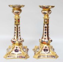 A Pair of Royal Crown Derby Imari Candlesticks Both first quality, no chips or cracks, wear to