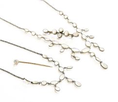 A Moonstone Necklace, graduated oval moonstones suspending a graduated central fringe, to a trace