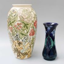 Two Modern Moorcroft Vases, one decorated with stylised flowers on a cream ground, 32cm high, the