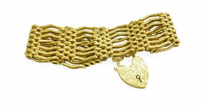 A Gate Link Bracelet, of textured and plain links, the padlock and bracelet both stamped '9C',