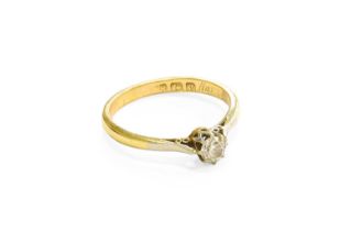 An 18 Carat Gold Diamond Solitaire Ring, the old cut diamond in a white claw setting, to a yellow