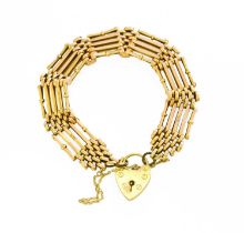 A Gate Link Bracelet, stamped '15CT', with a 9 carat gold heart shaped padlock clasp, length 18cm