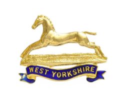 An Enamel 'West Yorkshire' Regimental Brooch, measures 3.2cm by 2.6cm Stamped '9CT', 'T.L.M'.