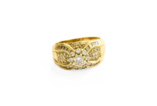 An 18 Carat Gold Diamond Cluster Ring, the central raised cluster formed of round brilliant cut