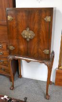 A Reproduction Brass Mounted Mahogany Cocktail Cabinet, on scroll carved shallow carbiole legs