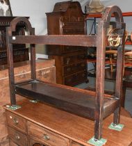 A Two Tier Oak Trolley, with brass handles and castors, 95cm by 30cm by 82cm