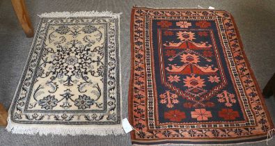 Bergama Prayer Rug, the deep indigo field of stylised flowerheads beneath a stepped mihrab 104cm