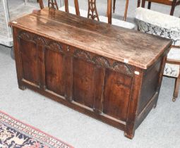 An 18th Century Four Panel Oak Coffer, with lunette carving, 121cm by 50cm by 65cm