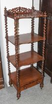 A Victorian Mahogany Four Tier Whatnot, with pierced gallery and barley twist supports, 48cm by 37cm