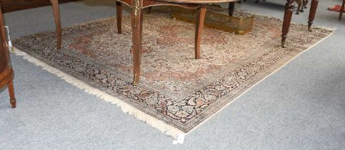Kashmir Silk Piled Carpet, the ivory field richly decorated with vines around a terractotta