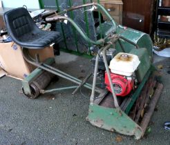 An Atco Vintage Ride On Lawn Mower, in working order