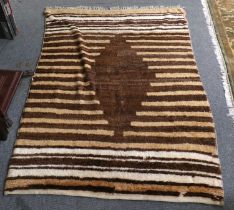 Rare Tulu Rug, the field comprised of narrow bands centred by a stepped medallion, 186cm by 131cm