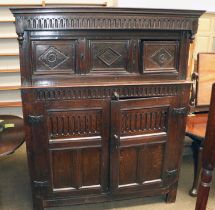 An 18th Century Carved Oak Court Cupboard, chip carved and decorated with lozenges, one side