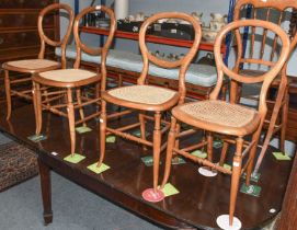 A Set of Four Caned Balloon Back Chairs