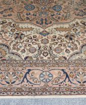Kayseri Carpet, the ivory field of vines centred by a pale coral pink medallion framed by