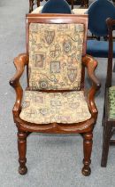 A 19th century Mahogany Open Armchair, with dish seat, turned legs and a crinoline stretcher