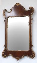 A George III Style Parcel Gilt Fretwork Mirror, 59cm by 101cm