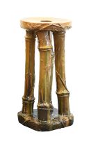 Attributed to Linthorpe Pottery: A Jardiniere Stand, in the form of four bamboo canes, glazed in