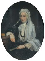 Sir James Gunn RA (1893-1964) Portrait of a lady, three-quarter length seated at a desk, wearing