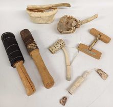 A Collection of Canadian Inuit Tools, Utensils and Games, comprising two Ceremonial drum beaters