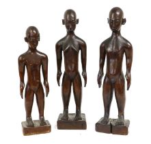 A Set of Three East African Wood Figures, possibly Shambala, Tanzania, carved as a man, woman and