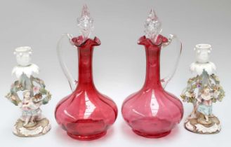 A Pair of Sitzendorf Porcelain Candlestick Figures, and a pair of cranberry glass claret jugs and