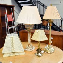 An Onyx Table Lamp, with brass Corinthian cap, clear glass reservoir and stepped square plinth