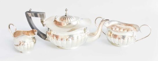 A Three-Piece Edward VII Silver Tea-Service, by Joseph Gloster, Birmingham, 1904, each piece lobed